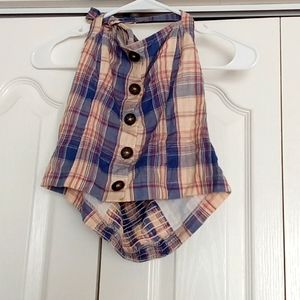 Sleeveless crop top plaid with ties to tie around your neck like a Halter.